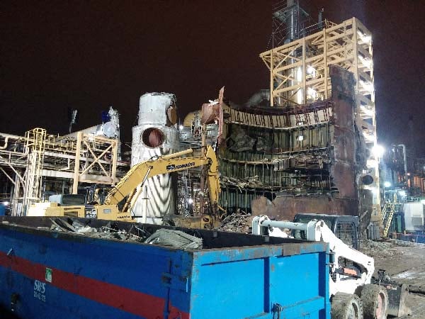 Night demolition of tank during plant shutdown